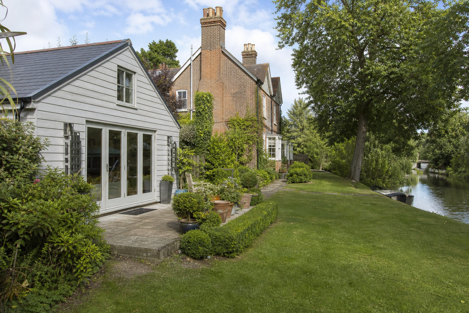 Wide garden view of the annexe beside the main house