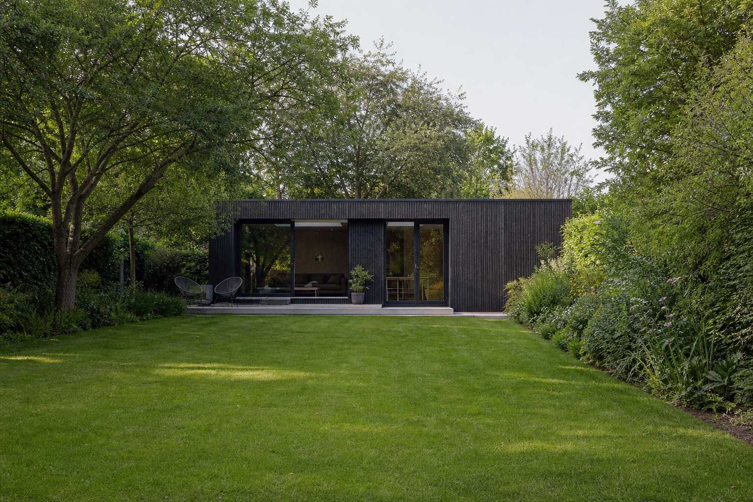 Wide view across the garden toward the contemporary garden room